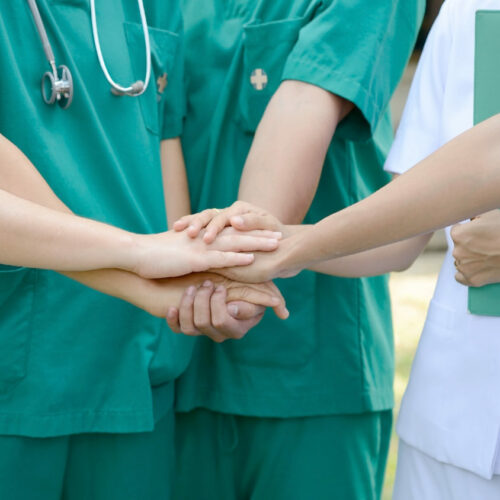 Doctors surgeon and nurses in a medical team stacking hands Doctors surgeon and nurses in a medical team stacking hands.